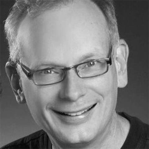 man smiling glasses short hair black and white