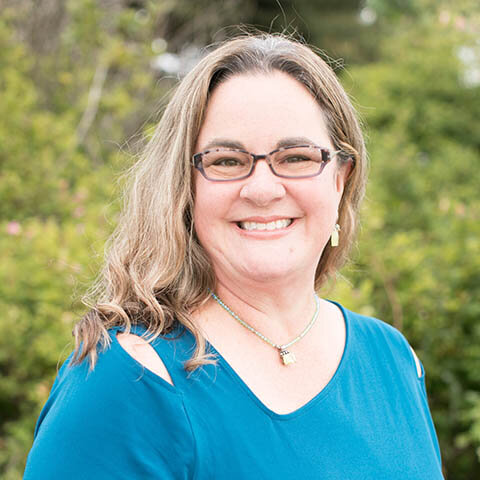 woman smiling glasses long hair