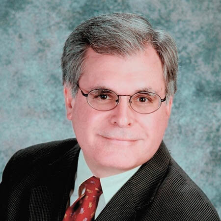 man smile glasses suit tie